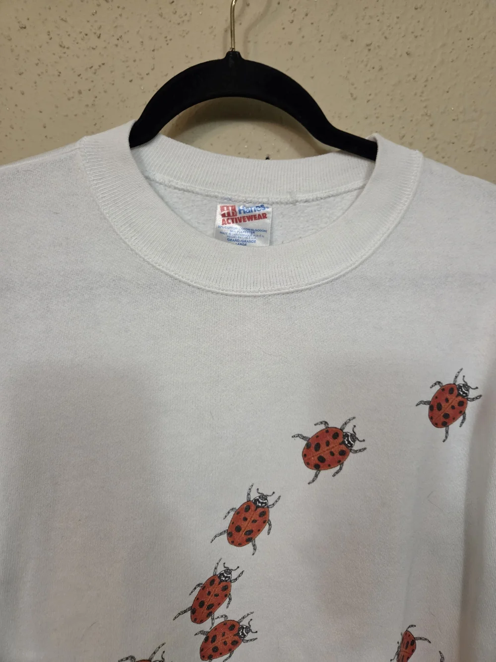 Vintage Hanes White Crewneck Sweatshirt with Red Ladybug Print 80's
